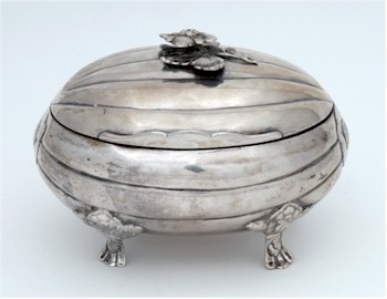 A late 18th century Russian silver casket of melon form, raised on floral decorated feet, made in St Petersburg in 1785.