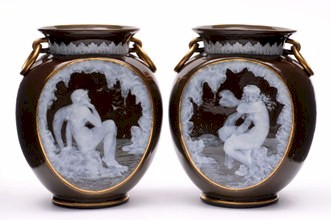 A pair of George Jones pate sur pate vases by Frederick Schenck.