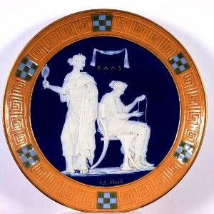 A pate sur pate plate signed by Frederick Alfred Rhead.