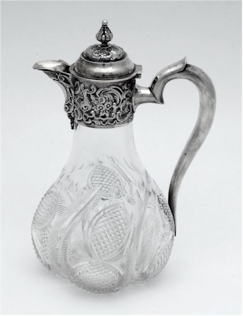 A simpler Edwardian claret jug with simple engraved decoration, London, 1901.