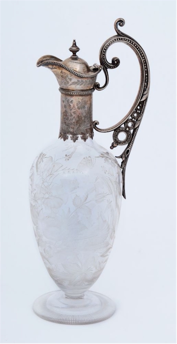 A Victorian claret jug, this time with cut decoration of sunburst and hobnail decoration, London 1898.