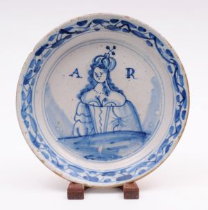 An English delft royal commemorative plate for the reign of Queen Anne.
