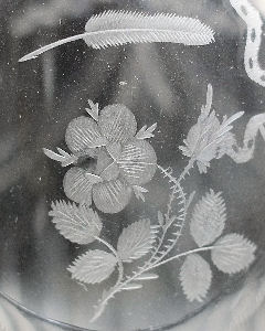 Detail of the Pen and Rose rebus that features on a Waterford glass and decanter (FS21/458).