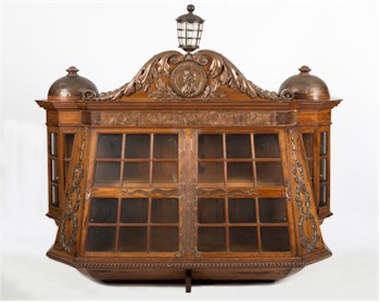 A wall cabinet constructed from the timbers and copper of HMS Foudroyant is estimated at between £5,000 and £7,000 and 
        will be auctioned in the Maritime Sale on 11th June 2014.