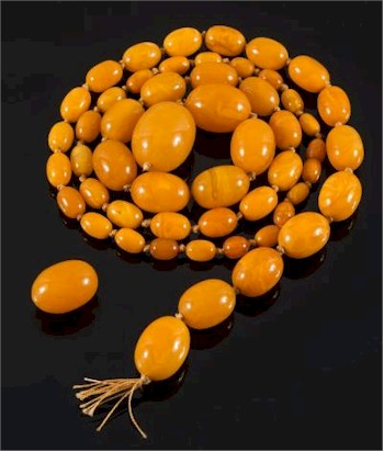 There is another single-string necklace with amber coloured beads (FS30/191) that is carrying a pre-sale estimate
        of £1,500-£2,000.