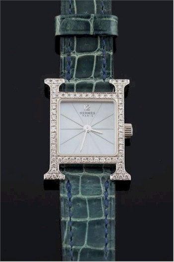 A Hermes lady's 18ct white gold and diamond set H wristwatch (FS30/113) realised £3,500.