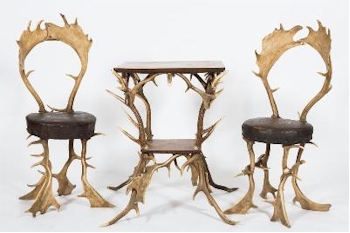 The furniture auction includes an unusual pair of 'Antler' chairs and table From
        Schloss Georgium (FS33/1212).