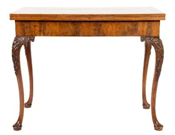 A Carved Walnut Rectangular Card Table (FS36/870) fetched £4,500.