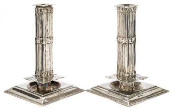 A pair of continental silver candlesticks, bearing French import marks (FS36/110), fetched £3,000 in the silver auction.