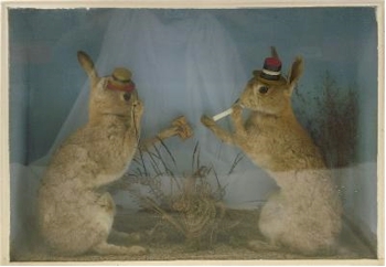 An early 20th Century Cased Set of Anthropomorphic Hares (SC25/76).