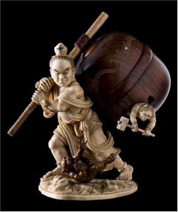 A Japanese ivory and boxwood okimono of Nio slaying Oni demons (FS37/900) realised £4,000.