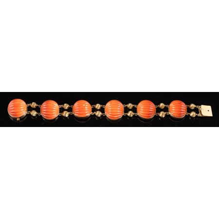 A Mid 20Th Century Coral Bracelet, The Carved Oval Shaped Coral With Reeded Beads