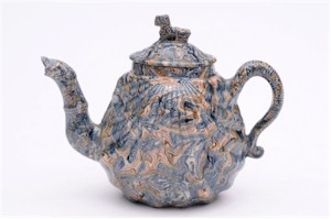 Staffordshire potters such as Whielden probably had an influence on the development
            of Majolica pottery, which can be seen when compared with this Staffordshire Solid
            Agate Teapot and Cover (FS17/564).
