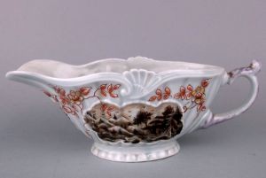 A Samson copy of an early Worcester porcelain sauce boat in a somewhat garish palette.