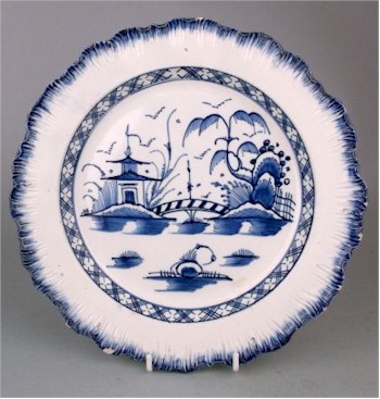A pearlware plate attributed to Liverpool showing a typical candy stripe bridge.