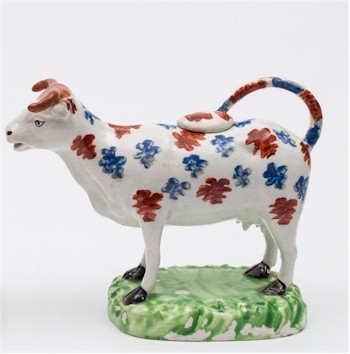 A lustrous Cambrian cow creamer from 1810.