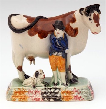 A prize winning Yorkshire cow and farmer with his faithful lion, circa 1810.
