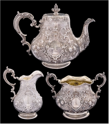 Heavy ornamentation on this Victorian silver pear-shaped tea service by
        Robert Hennell III, London, 1861 (FS41/110).