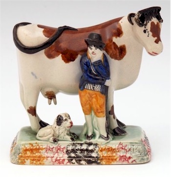 A North Country farmer with his prize cow, circa 1800.