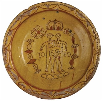 A Donyatt pottery charger depicting the Ilse Brewers twins (Courtesy South West
        Heritage Trust).