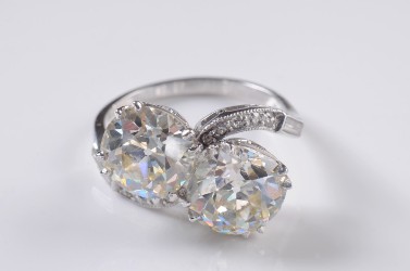 a platinum and diamond two stone cross over ring (fs18/294) sold for £16,500