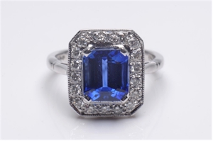 An 18 ct white gold, sapphire and diamond mounted rectangular cluster ring