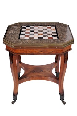 A George IV brass mounted rosewood octagonal games
        table with inlaid marble chess board. Realised: £1,500. (FS15/741).