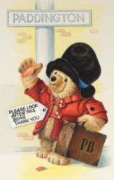A watercolor of Paddington dressed in a red duffle coat waving goodbye
        at the railway station of his name. He has a luggage label round his neck, bearing
        the legend 'please look after this bear thank you.'