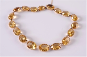 A late 19th century gold and citrine mounted riviere necklace. Realised £2,000. (FS15/172).