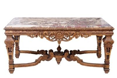An imposing 19th century French carved giltwood centre table, which was great sought
        after by those bidding, finally fell for £11,500. (FS17/850).
