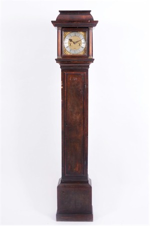 A miniature walnut longcase clock in the Queen Anne style, made circa 1840, and
        signed for Samuel Atfield of Brentford, sold for £1,800. (FS17/752).
