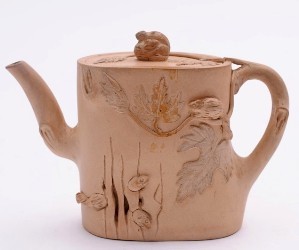 An Yixing teapot, modelled as squirrels emerging from a tree trunk, recently sold for £1,250 in our January 2013 Fine Sale (FS17/537).