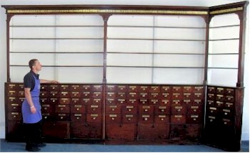 The huge Victorian mahogany pharmacy cabinets made by John Curtis & Son of Leeds (SF18/1056), estimated at between £4,000
        and £6,000 that will be auctioned on 5th July 2013 in Honiton.