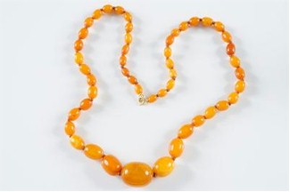 Amber jewellery is increasingly popular and is achieving ever higher prices in salerooms. We are offering two amber beaded necklaces
        in the Autumn 2013 Fine Sale. This single string example that carries an estimate of £300-£500 (FS20/206).