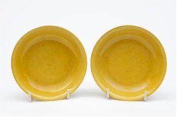 A Pair of Chinese Yellow Glazed Small Saucer Dishes (FS20/624) exceeded all expectations finally attracting a winning
       bid of £23,000.