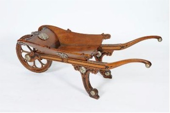 A fine and unusual Victorian carved walnut presentation wheelbarrow (FS20/1106) was sold for £5,200 in a sale that
        saw all sections attracting considerable interest from across the World.