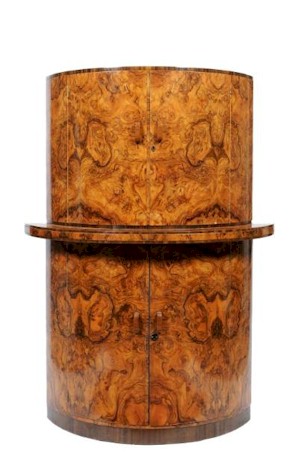 This Art Deco walnut veneer cocktail cabinet (SF19/1298) was keenly sought after and finally
        succumbed to a winning bid of £2,350.