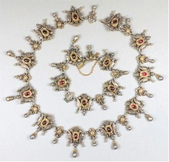 This late 19th Century parcel gilt and garnet mounted necklace with matching bracelet is expected to realise between £1,800 and £2,200 when they go under the hammer in
        the Exeter salerooms.