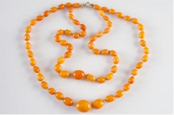 This graduated amber bead double string neckless (FS21/186) is expected to attract bids of several hundred pounds.