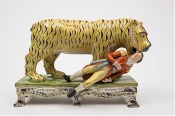 Lieutenant Hector Munroe met a grisly end when attacked on 2nd December 1792 by a tiger in India - as modelled
        in this rare Staffordshire pearlware group (FS22/580), which has a pre-sale estimate of £3,000-£5,000.