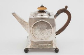This George III teapot (FS22/116) is quite unusual, being almost cubist in style. It is believed to have been made by the silversmith John
        Robins of London in 1799.