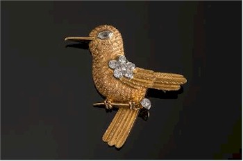 This Cartier diamond mounted bird on a branch brooch (FS24/192) sold for £3,500.