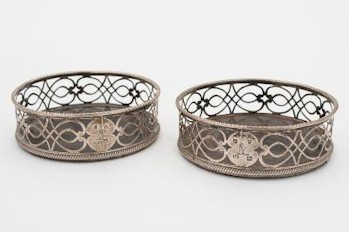 A pair of George III silver coasters (FS25/135) is amongst the fine antique silver
        being auctioned during the January 2015 Fine Sale, which will feature live online
        bidding for those unable to be present in our auction rooms during the sale.