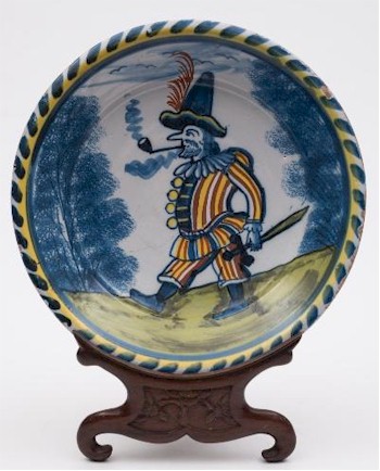 Another rare delftware charger painted with a figure representing Pulcinella (FS26/492) also exceeded expectations, selling for £11,500.