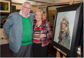 Robert and Gina Gearing with an iconic self-portrait of Robert Lenkiewicz (1941-2002).