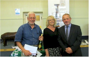 Bob Payne, winner of the Call My Bluff Quiz held in support of Kingsbridge and Salcombe
        Macmillan Cancer Support Group with Daniel Goddard (right) and event organiser Julie
        Thompson.
