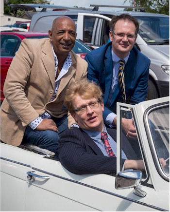 Raj Bisram and Charles Hanson of Antiques Roadtrip enjoy a break from filming with Brian
        Goodison-Blanks.
