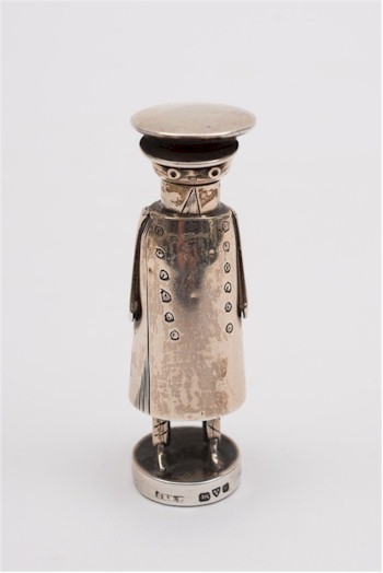 A novelty salt in the form of a uniformed chauffeur (FS26/94), which realised £340.