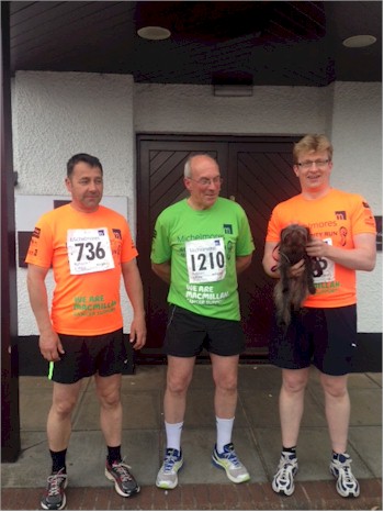 Nic Saintey (Director), Chris Hampton (Managing Director) and Brian Goodison-Blanks (Senior Valuer) holding Basil Littlewood (the firm's canine mascot) awaiting the start of the run.