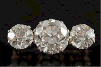 A Diamond Mounted Three-stone Bar Brooch (FS27/224) realised £17,000.